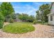 An expansive backyard with a combination of lush green lawn and low-maintenance rock landscaping at 20738 E Grand Pl, Aurora, CO 80015