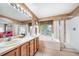 Well-lit bathroom boasting a double vanity, soaking tub, and glass-enclosed shower at 20738 E Grand Pl, Aurora, CO 80015