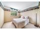Bedroom with plush carpet and a lovely window to let in the sunlight at 20738 E Grand Pl, Aurora, CO 80015