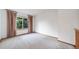 Upstairs Bonus Room with neutral carpet and lots of natural light at 20738 E Grand Pl, Aurora, CO 80015