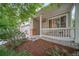 Single-Gathering home with an inviting porch, well-maintained lawn, and attached two-car garage and beautiful shrubbery at 20738 E Grand Pl, Aurora, CO 80015