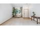 Inviting foyer with large plant and ample natural light at 20738 E Grand Pl, Aurora, CO 80015