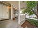 Inviting front porch with cozy seating area and well-maintained landscaping at 20738 E Grand Pl, Aurora, CO 80015