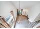 View of the living room from the upper level with bright windows and staircase at 20738 E Grand Pl, Aurora, CO 80015