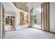 Open-concept living room with decorative chandelier and large window at 20738 E Grand Pl, Aurora, CO 80015