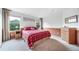 Comfortable main bedroom with two windows and a wooden trim at 20738 E Grand Pl, Aurora, CO 80015