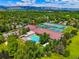Overhead view of community features a pool, tennis courts, green spaces, and mountain backdrop at 5530 Racquet Ln, Boulder, CO 80303