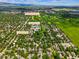 Aerial shot shows the property's location near the golf course, the Meadows Club, and the neighborhood at 5530 Racquet Ln, Boulder, CO 80303