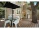 The back deck provides access to the house and features shady, outdoor dining space at 5530 Racquet Ln, Boulder, CO 80303