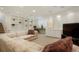 Finished basement featuring an entertainment area with shelving, cabinetry, and comfortable furniture at 5530 Racquet Ln, Boulder, CO 80303