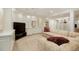 Finished basement featuring built-in shelving, and a comfortable seating area with a TV at 5530 Racquet Ln, Boulder, CO 80303