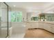 Luxurious bathroom features a soaking tub and large vanity area and a glass shower at 5530 Racquet Ln, Boulder, CO 80303