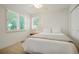 Cozy bedroom with soft lighting and a neutral color palette and bright windows at 5530 Racquet Ln, Boulder, CO 80303