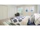 Comfortable bedroom with a patterned bedspread and blue accents, and sunlit windows at 5530 Racquet Ln, Boulder, CO 80303