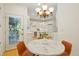 Charming dining area featuring a view into the kitchen and a glass door with access to the outdoors at 5530 Racquet Ln, Boulder, CO 80303