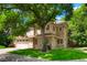 Charming two-story home featuring a well-maintained lawn, mature trees, and a spacious two-car garage, perfect for families at 5530 Racquet Ln, Boulder, CO 80303