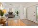 Bright living room featuring a fireplace, high ceilings, neutral decor, and an open entryway, perfect for relaxation and entertaining at 5530 Racquet Ln, Boulder, CO 80303