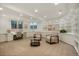 Bright living room features built-in bookshelves, a cozy seating area, and neutral decor at 5530 Racquet Ln, Boulder, CO 80303