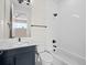 Modern bathroom with stylish vanity, sleek fixtures, and a pristine white-tiled shower-tub combo at 7066 W 13Th Ave, Lakewood, CO 80214