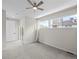 Spacious bedroom with carpet, a ceiling fan, and a sliding glass door to a private balcony at 7066 W 13Th Ave, Lakewood, CO 80214
