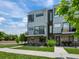 Modern townhome features sleek architectural details and private balcony perfect for outdoor living at 7066 W 13Th Ave, Lakewood, CO 80214