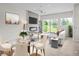 Bright living room with fireplace, open layout, and sliding glass doors to a balcony at 7066 W 13Th Ave, Lakewood, CO 80214