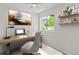 Cozy office space with a wooden desk, comfortable chair, and natural light from the window at 7066 W 13Th Ave, Lakewood, CO 80214