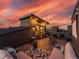 Relaxing rooftop deck at sunset, with cozy seating and picturesque views at 7066 W 13Th Ave, Lakewood, CO 80214