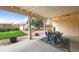Cozy covered porch with outdoor seating, perfect for relaxing and enjoying the backyard views at 7100 W Ellsworth Pl, Lakewood, CO 80226