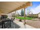 Cozy covered porch with outdoor seating, perfect for relaxing and enjoying the backyard views at 7100 W Ellsworth Pl, Lakewood, CO 80226