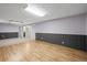 Spacious basement with paneled walls, vinyl flooring and carpeting throughout, and recessed lighting at 7100 W Ellsworth Pl, Lakewood, CO 80226