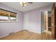 Charming bedroom with hardwood floors, closet, and large window for natural light at 7100 W Ellsworth Pl, Lakewood, CO 80226