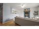 Bright and airy living room with hardwood floors, fireplace, and neutral decor, creating a welcoming atmosphere at 7100 W Ellsworth Pl, Lakewood, CO 80226