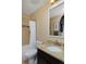 Bathroom featuring a vanity with granite countertop, a shower and a mirror at 8171 E 33Rd Ave, Denver, CO 80238