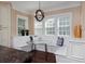 Charming breakfast nook features built-in seating, a glass-topped table, and natural light at 8171 E 33Rd Ave, Denver, CO 80238