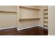 Spacious walk-in closet with hardwood floors and built in shelving at 8171 E 33Rd Ave, Denver, CO 80238