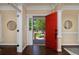 Home Foyer has hardwood floors, bright red door, and neutral walls at 8171 E 33Rd Ave, Denver, CO 80238