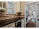 A well-appointed kitchen with custom cabinetry and granite countertops invites culinary exploration at 8171 E 33Rd Ave, Denver, CO 80238