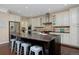 Spacious kitchen boasts a large center island with seating, stainless steel appliances, and stylish cabinetry at 8171 E 33Rd Ave, Denver, CO 80238