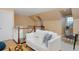 Cozy loft space with white sofa, wood flooring, and staircase with a stylish desk at 8171 E 33Rd Ave, Denver, CO 80238