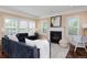 Bright and inviting living room boasts a fireplace, neutral colors, and stylish furniture at 8171 E 33Rd Ave, Denver, CO 80238