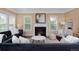 A bright and inviting living room features a cozy fireplace and stylish decor at 8171 E 33Rd Ave, Denver, CO 80238