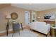 Stylish living space with hardwood floors, glass table desk, and comfortable seating at 8171 E 33Rd Ave, Denver, CO 80238