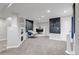 Finished basement featuring neutral carpet, a fireplace, recessed lighting, and white walls at 10609 Abilene St, Commerce City, CO 80022