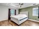 Bedroom with plush bed, neutral walls, and bright windows at 10609 Abilene St, Commerce City, CO 80022