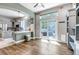 Dining area with patio access, hardwood floors, and open to the kitchen, perfect for entertaining at 10609 Abilene St, Commerce City, CO 80022