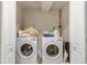 Functional laundry room equipped with a modern washer and dryer, plus storage at 10609 Abilene St, Commerce City, CO 80022