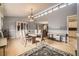 Elegant dining room with hardwood floors, a chandelier, and lots of natural light at 6072 Pierson Ct, Arvada, CO 80004