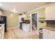 Well-lit kitchen with stainless steel appliances and lots of cabinet space at 6072 Pierson Ct, Arvada, CO 80004