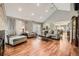 Bright living room with hardwood floors, vaulted ceilings, and an open floor plan at 6072 Pierson Ct, Arvada, CO 80004